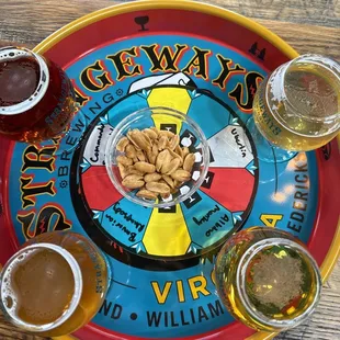 Four beer flight with complementary peanuts