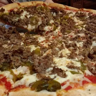 Cheese steak pizza with peppers and onions. 10/10