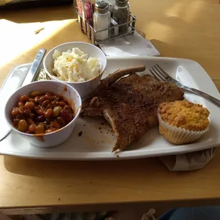 Lunch time with ribs, beans, slaw and fresh corn bread sitting outside in April.  Might snow tomorrow but for now, RIBS.