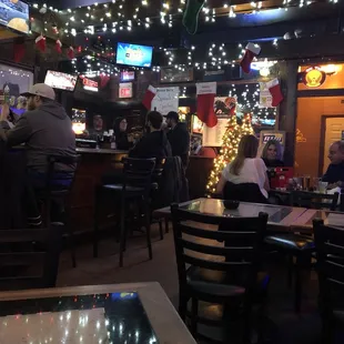 people sitting at tables in a restaurant