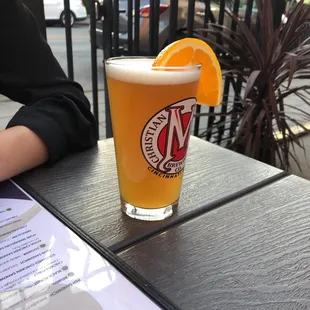 a glass of beer on a table