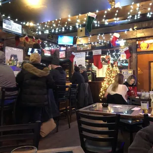 people sitting at a bar