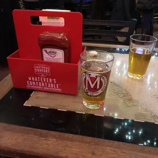 two glasses of beer on a table