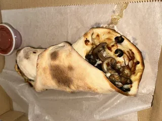 By Yuri’s Pizza