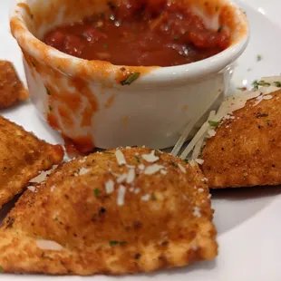 a plate of ravia and sauce