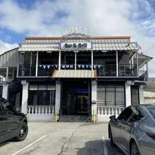 a car parked in front of a restaurant