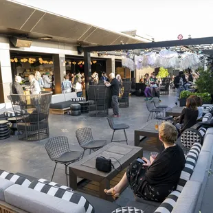 a group of people sitting on a patio