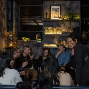 a group of people sitting around a table