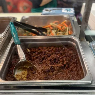 Thick and zesty chili and vegetables in the back