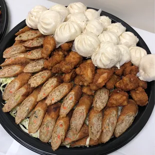 This platter is good (egg rolls, chicken wings, mini Manapua) *2/9/23