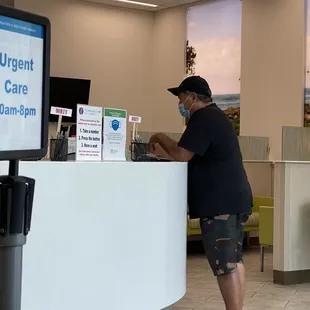 4-1-22 Hubs updating his booster info with the front desk.