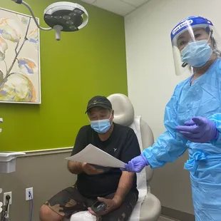 4-1-22 Nurse Robin gives us our summary sheets of the visit and gave hubs meds since he had a fever.