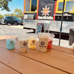 Multiple drinks ordered-  iced Vanilla Latte, Sunny Tiger Freeze, All Blue Freeze &amp; Passion Swan.