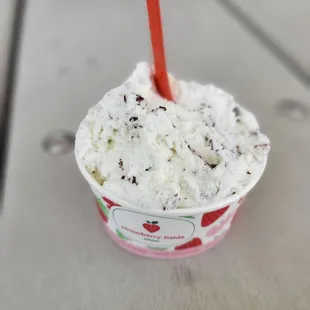 a cup of ice cream on a table