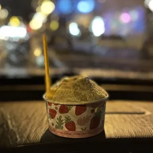 a cup of ice cream on a table