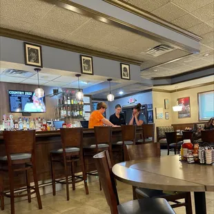 two people sitting at the bar