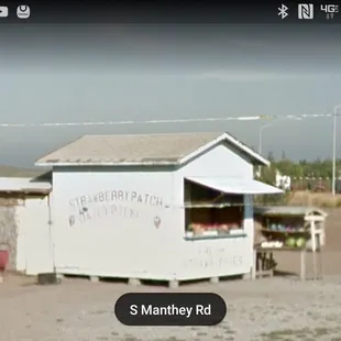 a small building with a sign on it