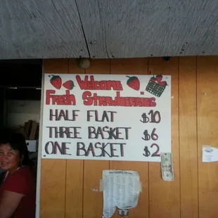 a woman standing in front of a sign