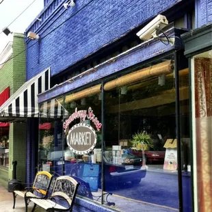 a bench in front of the store
