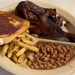 Half chicken with fries and baked beans