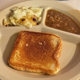 Scalloped potatoes and baked beans with Texas toast