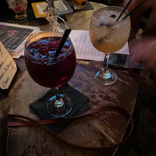 two cocktails on a table
