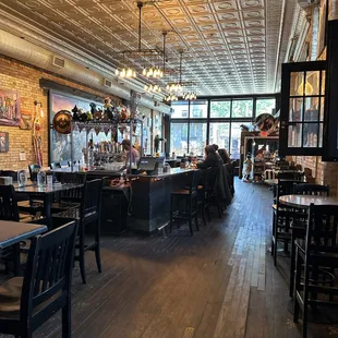 inside of a restaurant with a bar