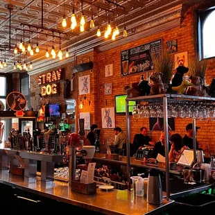 people sitting at a bar in a restaurant