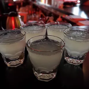 a row of glasses filled with liquid