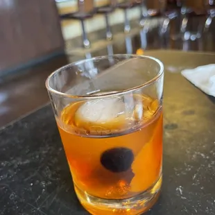 a drink in a glass on a table