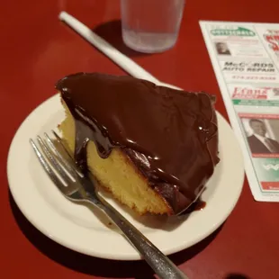 a piece of cake on a plate with a fork