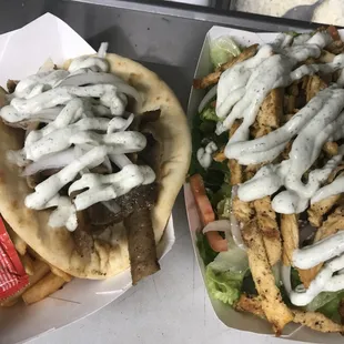 Gyro sandwich and chicken shawarma sandwich with fries.