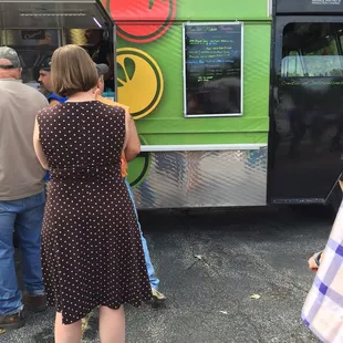 people getting food from a food truck