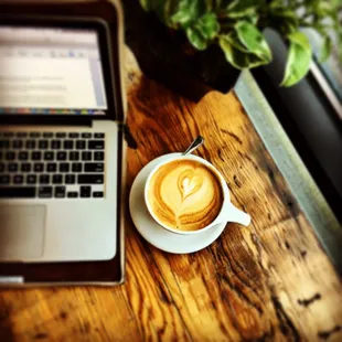 A great espresso and writing maybe the most blissful thing ever created. Caramel Latte with beautiful barista art.