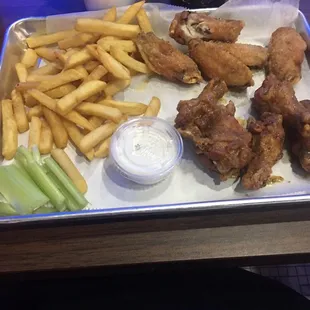 Half Lemon wet and half Parmesan wings with fries @ Street Bistro Midtown ATL