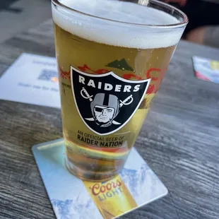 a glass of beer on a table