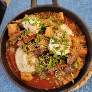 a skillet of food on a table