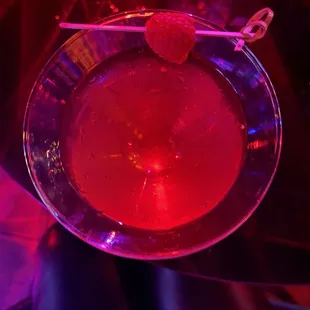 a red drink in a glass