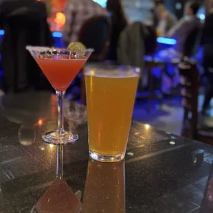 two cocktails on a bar