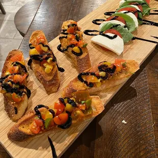 Buschetta, on some toasted baguettes, and a caprese appetizer to pair..