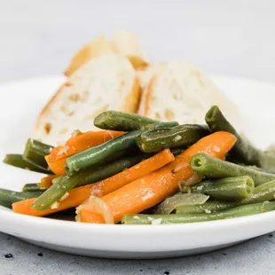 a plate of green beans and carrots