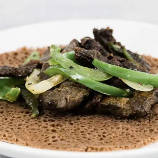 a plate of food with meat and vegetables