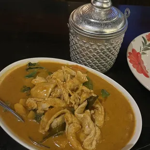 a plate of chicken curry