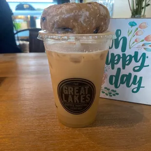 Iced street latte with a blueberry donut
