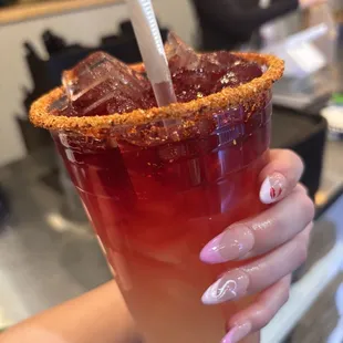 piña and jamaica frescos mixed with tajin rim