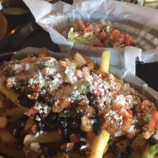 Al pastor fries during happy hour ($5.50) + 1 free taco with Yelp check in