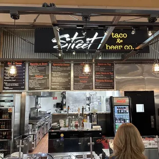 a woman standing in front of the counter