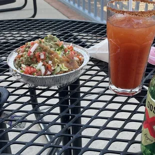 Michilada with Dos XX. Shredded beef bowl with $3 up-charge for guacamole.