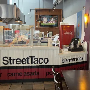 a view of the counter and dining area