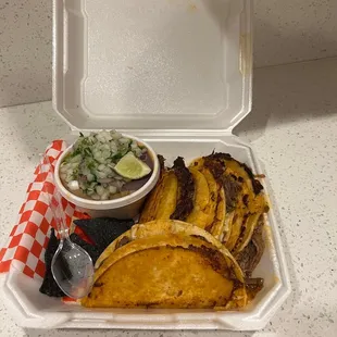 Quesabirria tacos with birria consommé